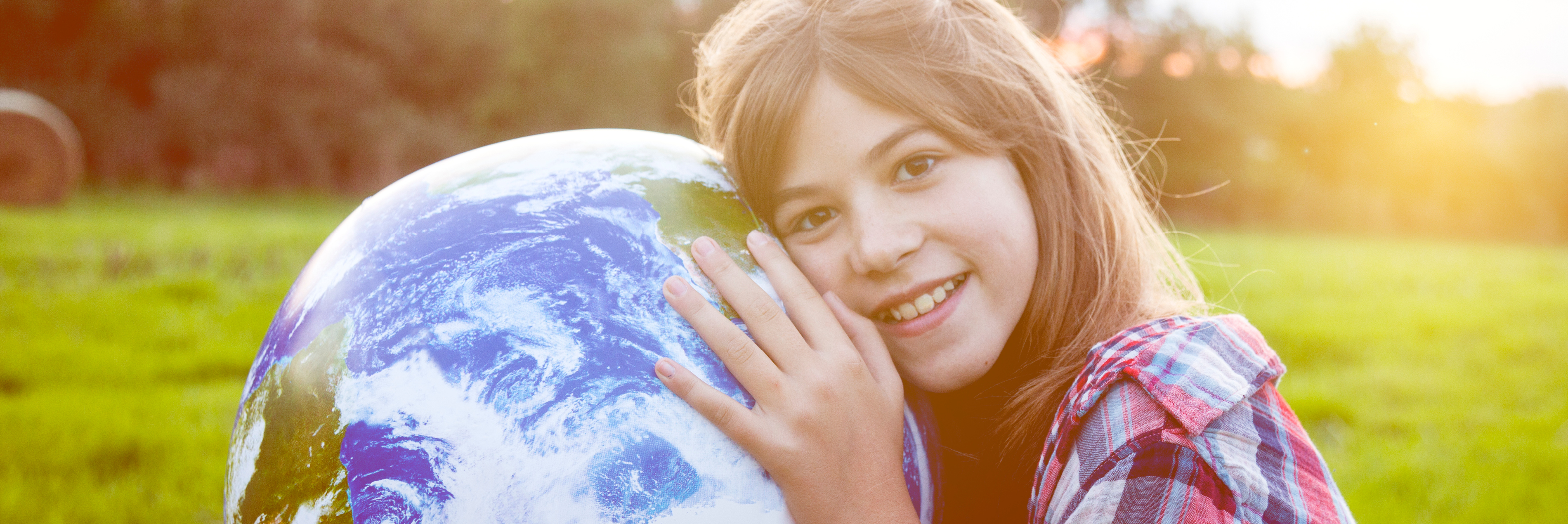 Girl hugging globe