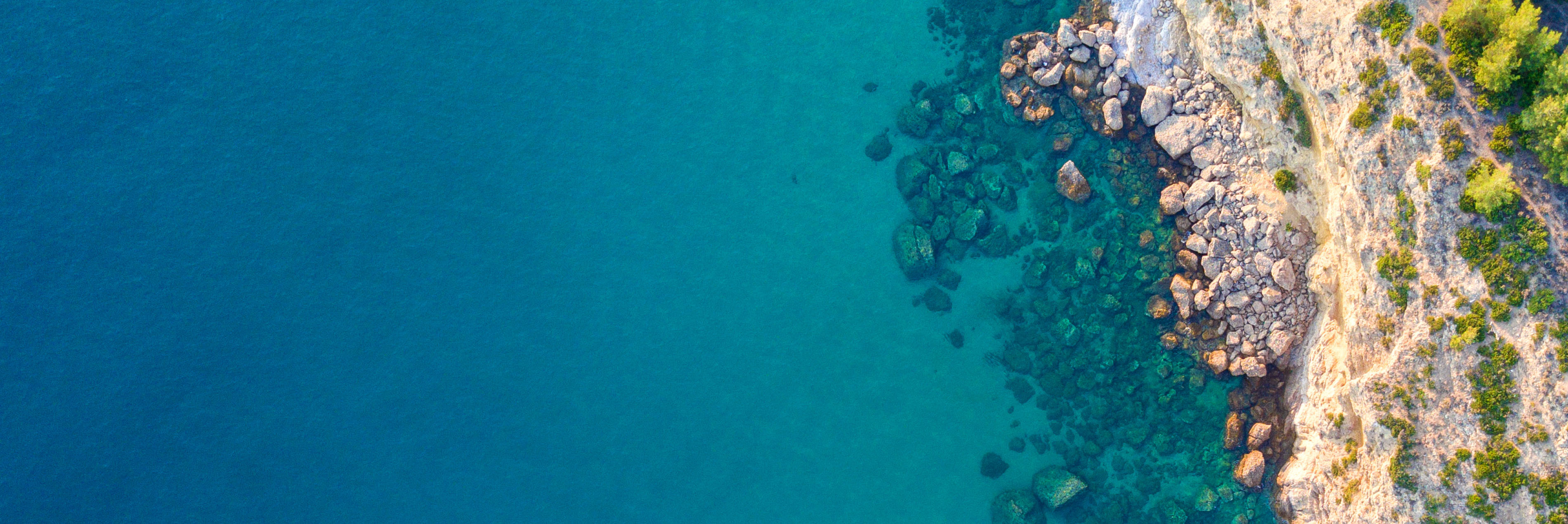 Blue water rocky shore