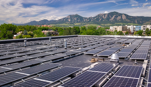 Solar panels surrounded by mountains