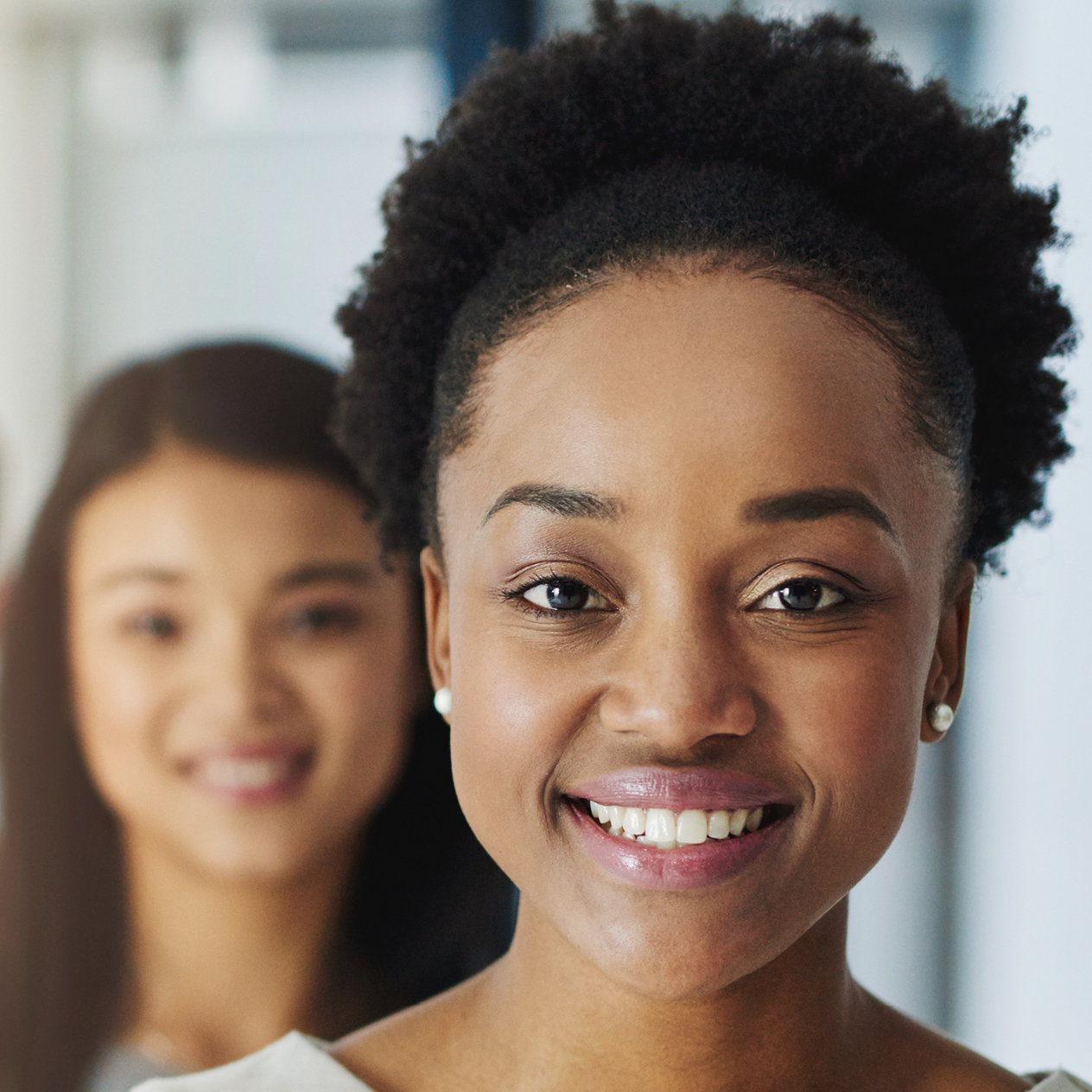 Three women's faces in a line